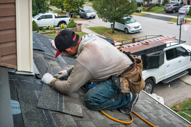 Professional Roof Replacement technician working in Greenlawn, NY